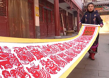 45秒丨指尖上的春节！枣庄艺人创作9米“百猪”剪纸长卷